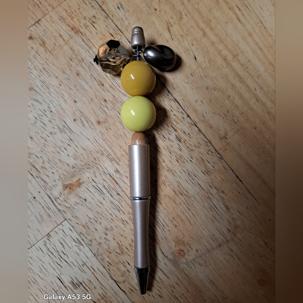 Title:On the bright side. Upcycled beads' new pen components and ink